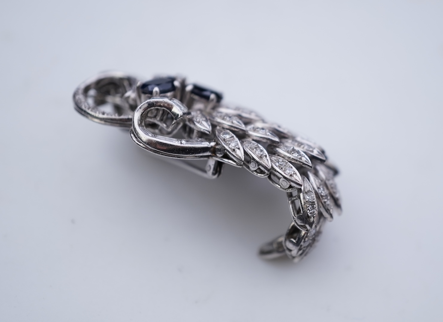 A sapphire and diamond brooch, mid 20th century